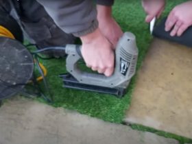 Cutting and fixing and artificial grass lawn