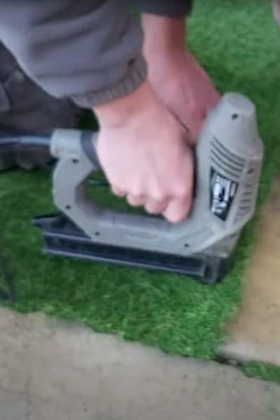 Cutting and fixing and artificial grass lawn